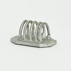 Miniature silver toast rack from a doll's house.