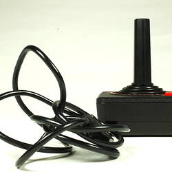 Rear of black plastic joystick showing power cable.