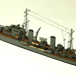 Naval ship with two masts, three quarter view.