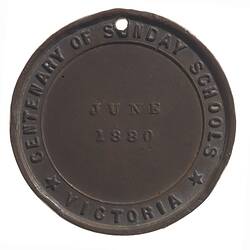 Round copper medal with date in centre. Text around.