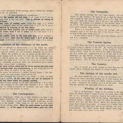 Open booklet with off-white pages and black printed text.