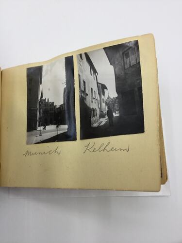 Two black and white photos glued on page of album with handwritten annotation in pencil beneath.