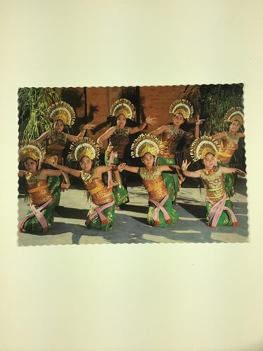 Two rows of posing Indonesian dancers.