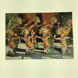 Two rows of posing Indonesian dancers.