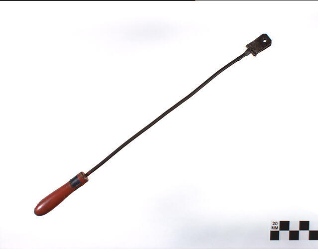Metal rod with red wood handle.