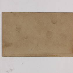 Retangular brown card.