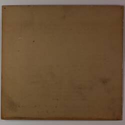 Back of off-white rectangular label.