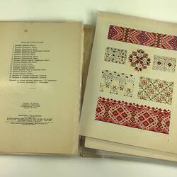 Open folder with colourful geometric designs and printed embroidery instructions.