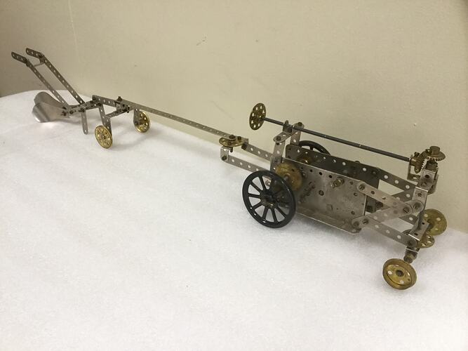 Meccano tractor and plough model.