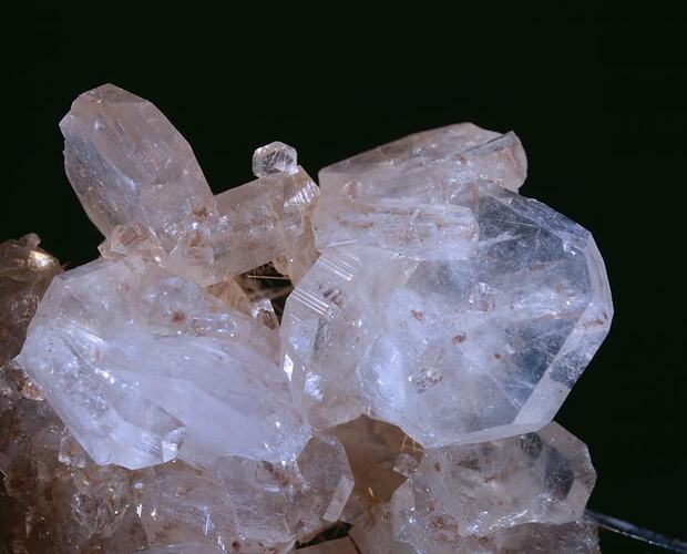 Clear white-purple crystals.