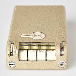 Rectangular cream metal case with four white labelled buttons at one end.