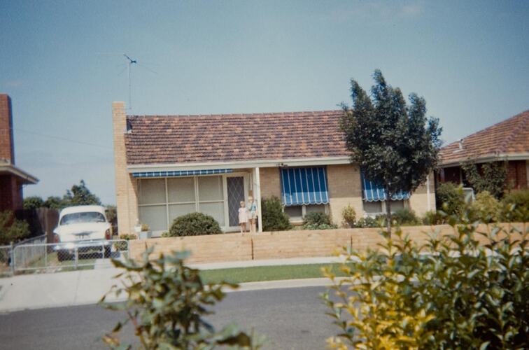 Digital Photograph - View of Boy & Girl on Front Steps of Brick House, with Hillman Car in Driveway, Glenroy, early 1960s