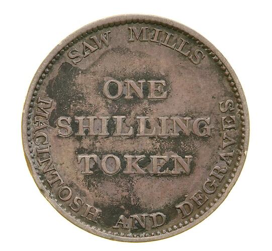Round token with raised text.