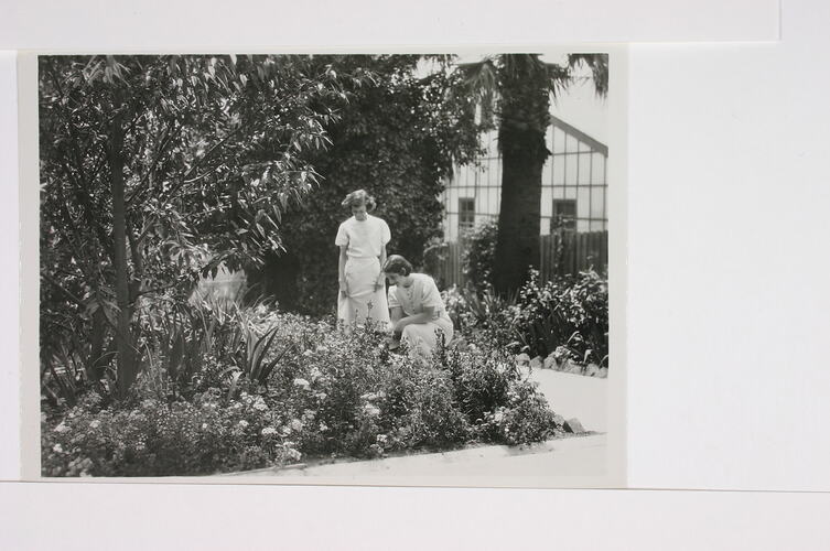 Photograph - Two Female Staff Standing in the Gardens, Kodak Factory, Abbotsford, early 1940s