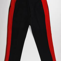 Black pants with red vertical strip running the sides of both legs, front view.