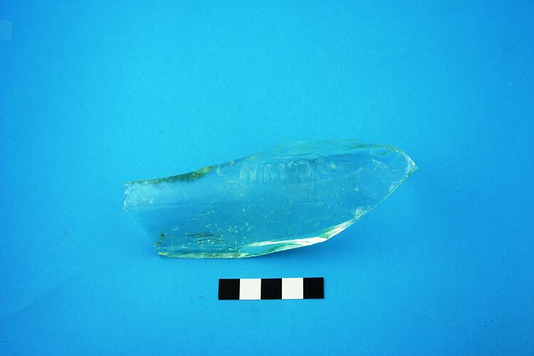 Fragment of green glass bottle.