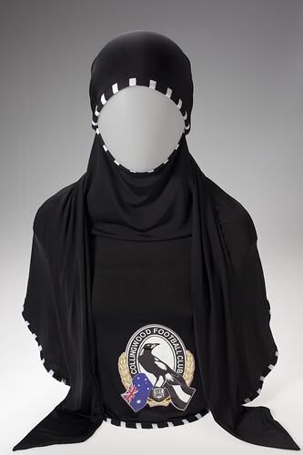 Black Collingwood hijabi with black and white trim.