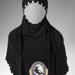 Black Collingwood hijabi with black and white trim.
