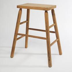 Four-legged timber stool.