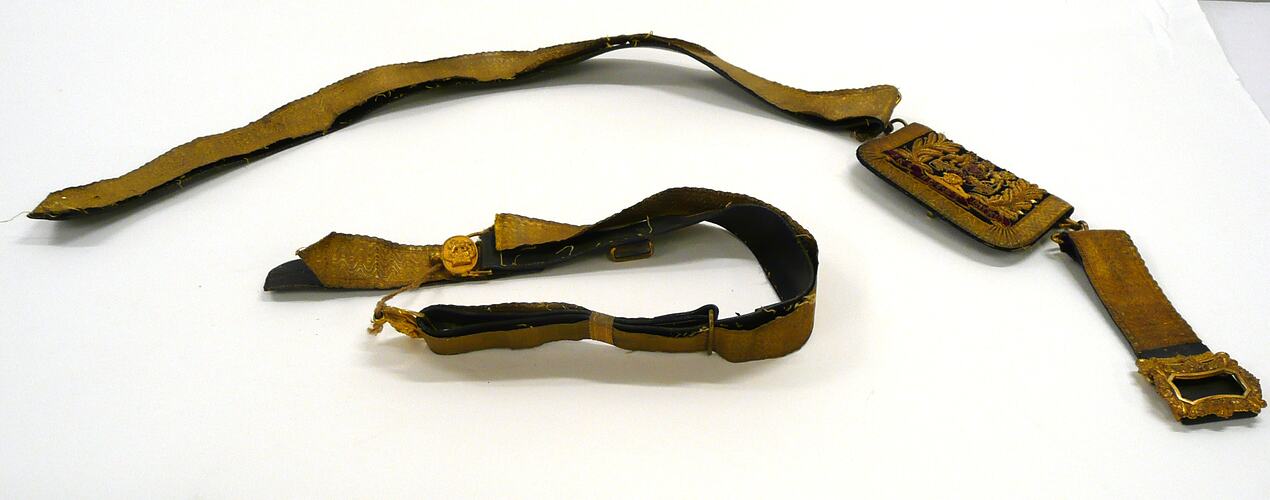 Leather belt covered in gold ribbon, in two pieces.
