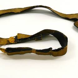 Leather belt covered in gold ribbon, in two pieces.