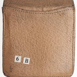 Small brown leather case showing numbers 6 B.