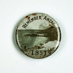 Badge with beach scene and text.