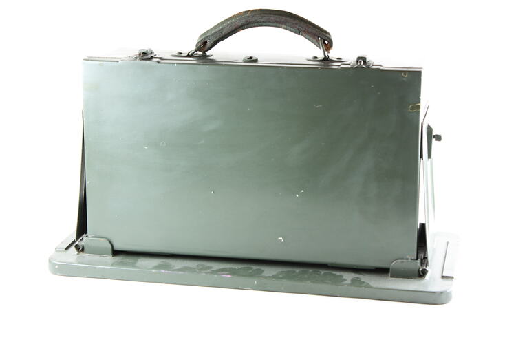 Khaki green metal case with carry handle.