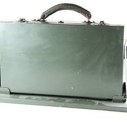 Khaki green metal case with carry handle.