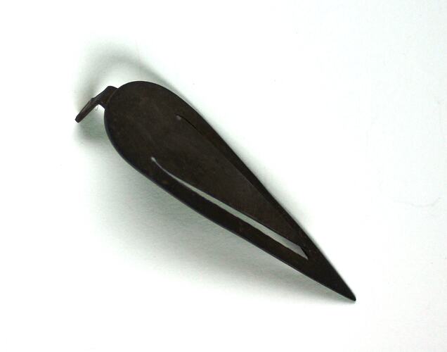 Leaf-shaped metal bookmark, tarnished to a brown colour.