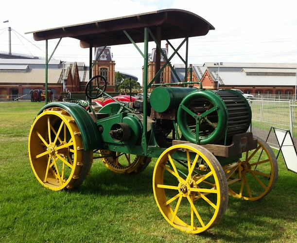 Green and yellow 'Sunshine' tractor on Scienceworks arena.