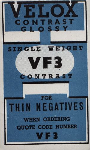 Blue paper label with printed black text.