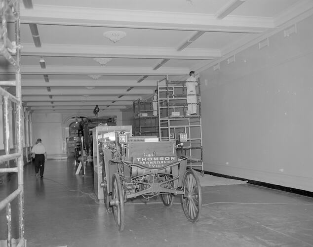 Setting up the transport display in Verdon Hall with Herbert Thomson steam car (ST 24990), Science Museum, Melbourne, 1970