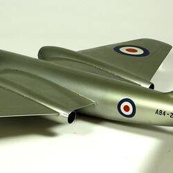 Silver model aeroplane. Three quarter back left view.