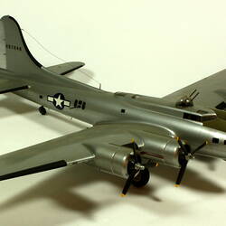 Silver model aeroplane. Three quarter front right view.
