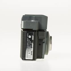 Black, grey and silver, metal and plastic 35mm camera. Right proflie.