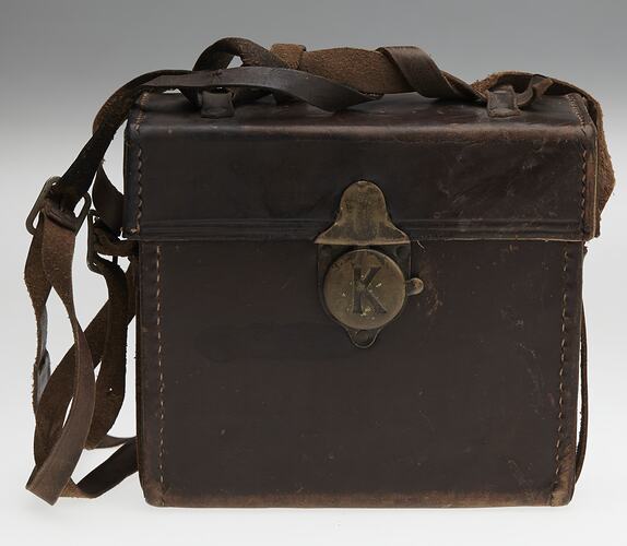 Brown leather carry bag with shoulder strap.