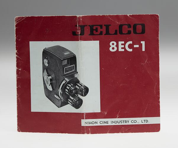Red printed foldout manual with image of camera.
