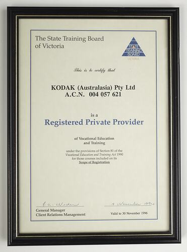 Cream cardboard certificate with blue and black text.