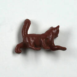 Toy brown cat, back view.