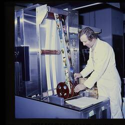 Slide - Kodak Australasia Pty Ltd, Man Operating Printer in Color Print Processing, Building 20, Coburg, circa 1960s