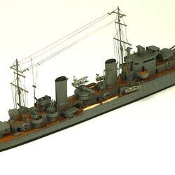 Naval ship with two masts, three quarter view.