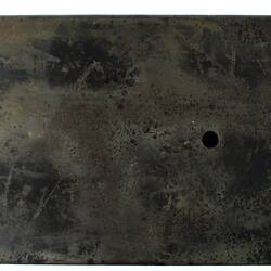 Black metal box (burnt).