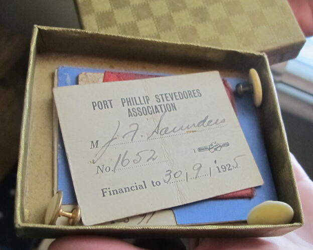 Open box with papers inside.