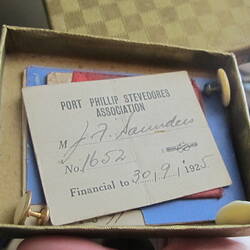 Open box with papers inside.