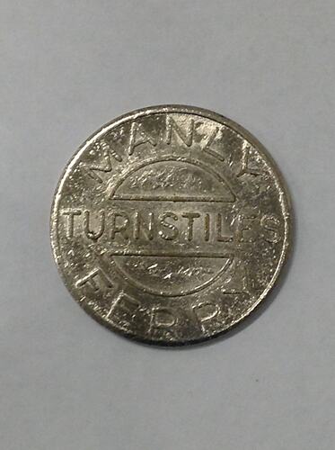 Round ferry transport token.