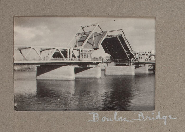 Metal bridge with drawbridge open.