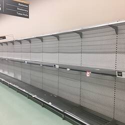 Empty supermarket shelving.