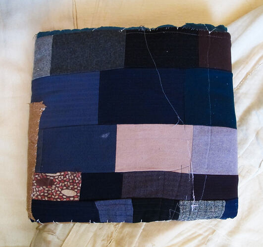 Cushion made of fabric patchwork.
