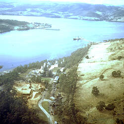 Negative - Aerial View of Wood Chip Mill Beside a River, 1970s